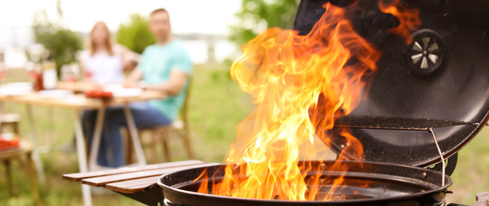 Barbecue grill with fire flames outdoors