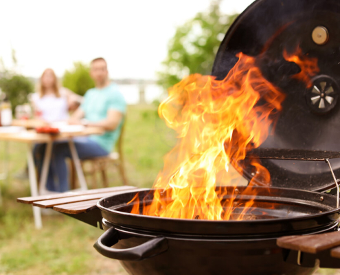 Barbecue grill with fire flames outdoors