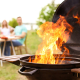 Barbecue grill with fire flames outdoors