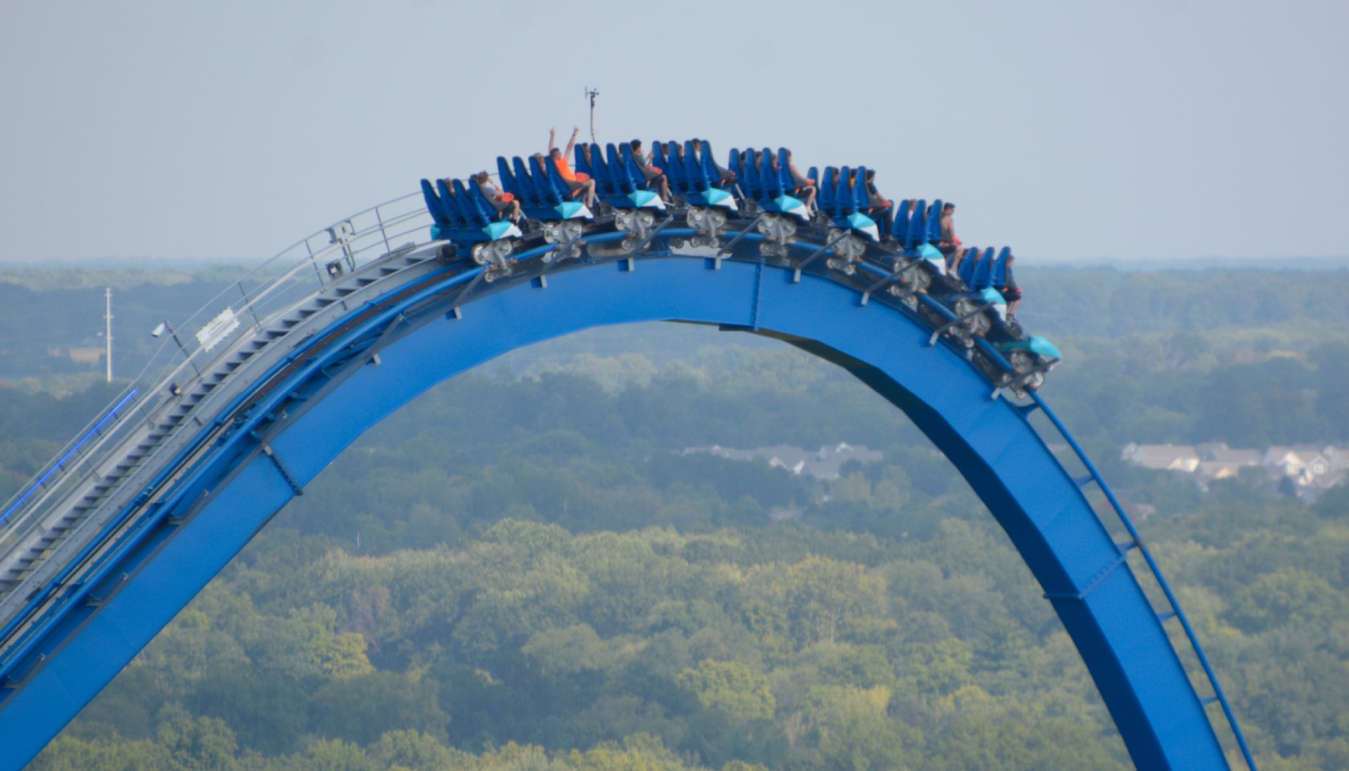 Riders at the top of the rollercoaster