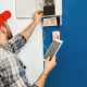 Technician conducting fire alarm system inspection