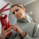 woman check the fire extinguisher expiration date at home
